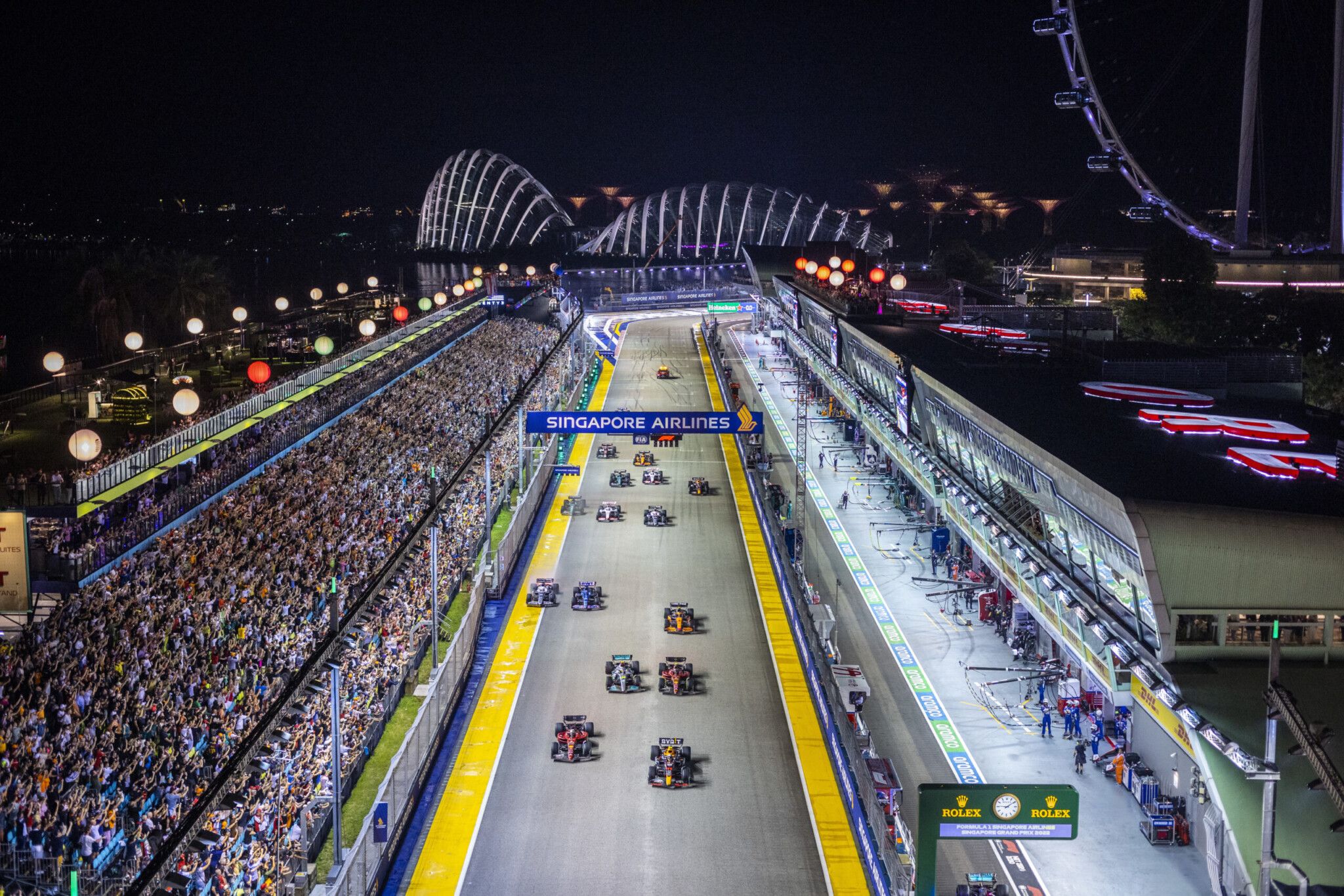 F1-cars-roaring-down-the-Singapore-Pit-Straight-scaled.jpg